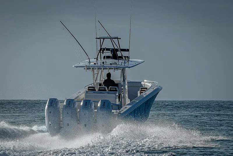 Slide: The Image of Bahama Quad V10's 2013 boat cruising on open water with four engines. - 35