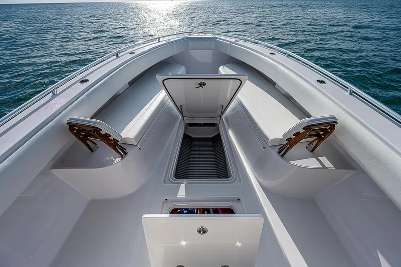 Slide: The Image of 2013 Bahama Quad V10's boat deck with open storage, surrounded by ocean. - 7