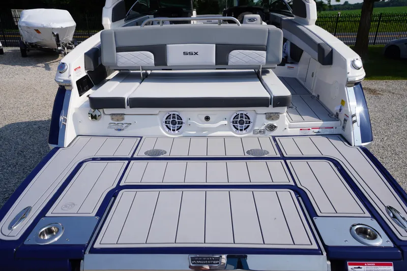 Slide: The Image of 2025 Chaparral 267 SSX boat with spacious deck and comfortable seating. - 13