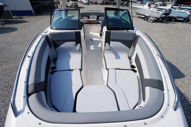 Slide: The Image of 2025 Chaparral 267 SSX boat interior with stylish seating and speaker. - 21