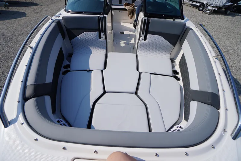 Slide: The Image of 2025 Chaparral 267 SSX boat interior with modern dashboard and steering wheel. - 26