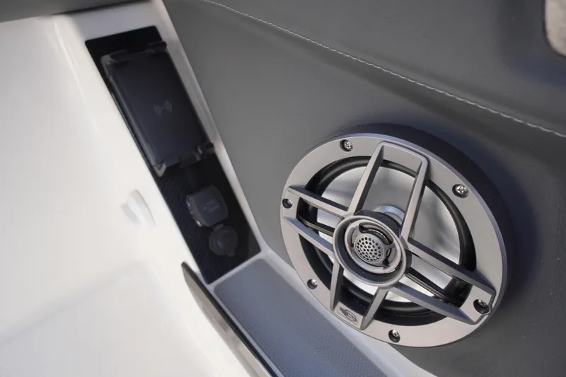 Slide: The Image of 2025 Chaparral 267 SSX boat cockpit with modern steering and luxurious seating. - 32