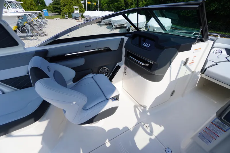 Slide: The Image of 2025 Chaparral 267 SSX boat interior with sleek dashboard and modern design. - 37