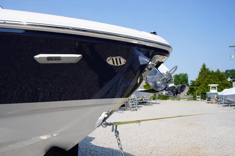 Slide: The Image of 2025 Chaparral 267 SSX boat anchor detail in a sunny outdoor setting. - 4