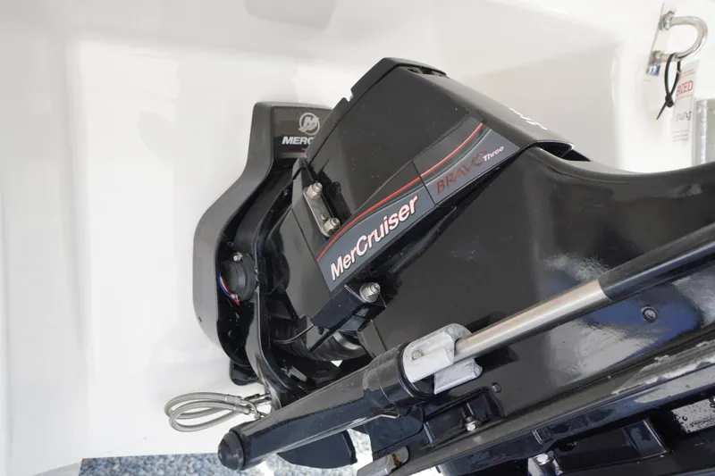 Slide: The Image of Propeller of 2025 Chaparral 267 SSX boat on gravel surface. - 8