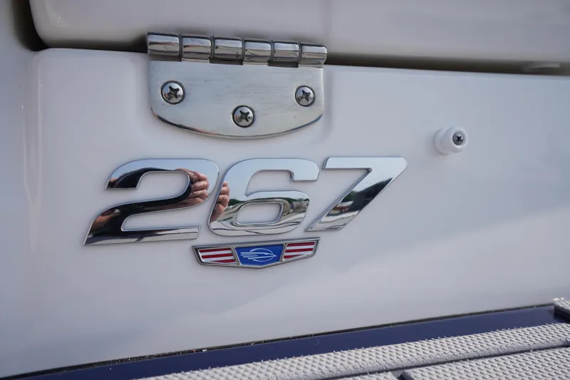 Slide: The Image of 2025 Chaparral 267 SSX boat deck with speakers and cushioned seating. - 10