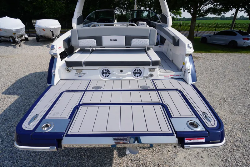 Slide: The Image of 2025 Chaparral 267 SSX boat with spacious rear deck and seating area. - 12