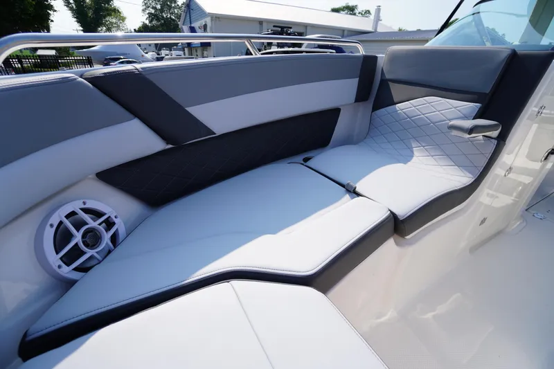Slide: The Image of 2025 Chaparral 267 SSX boat interior with sleek gray and white seating design. - 22