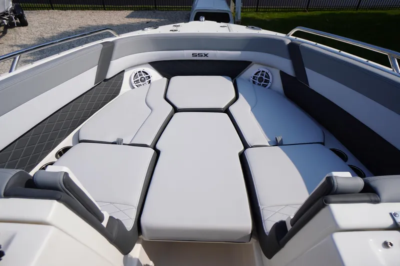 Slide: The Image of 2025 Chaparral 267 SSX boat interior with spacious seating and modern design. - 25