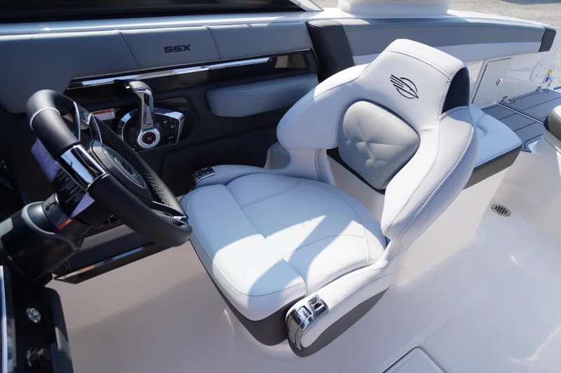 Slide: The Image of 2025 Chaparral 267 SSX boat interior with sleek seating and modern dashboard design. - 36
