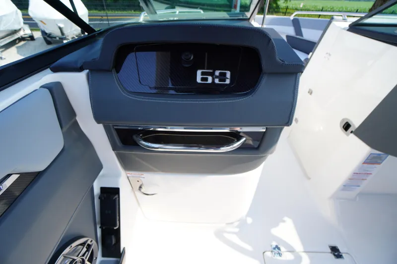Slide: The Image of 2025 Chaparral 267 SSX boat dashboard with sleek design and modern features. - 38