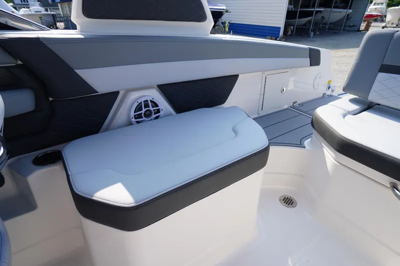 Slide: The Image of 2025 Chaparral 267 SSX boat storage compartment, open and empty. - 47