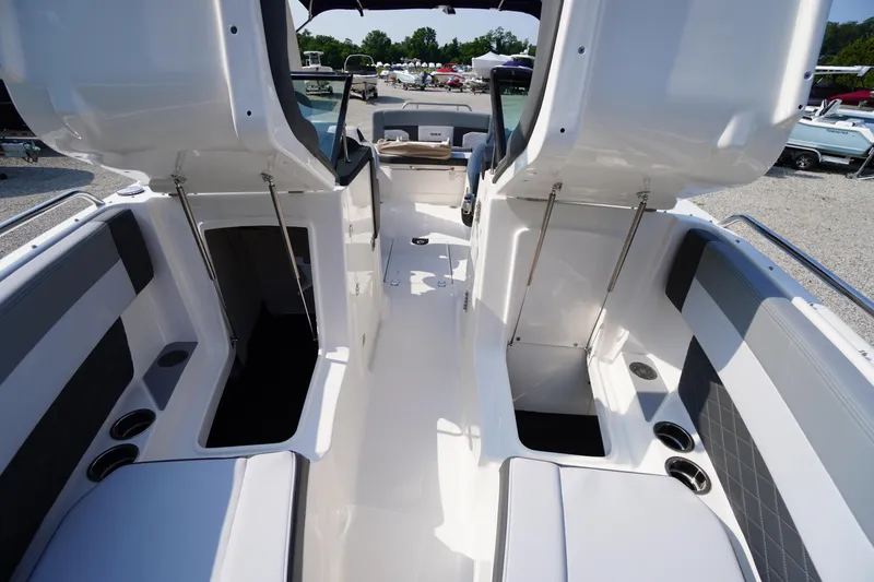 Slide: The Image of 2025 Chaparral 267 SSX boat interior with cushioned seating and sleek design. - 24