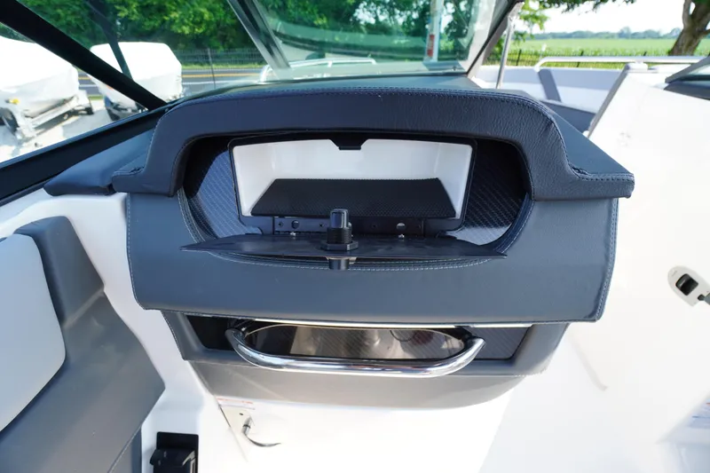 Slide: The Image of Interior view of 2025 Chaparral 267 SSX boat, featuring speaker and door handle. - 39