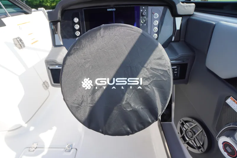 Slide: The Image of 2025 Chaparral 267 SSX boat interior with gray seating and modern design. - 45