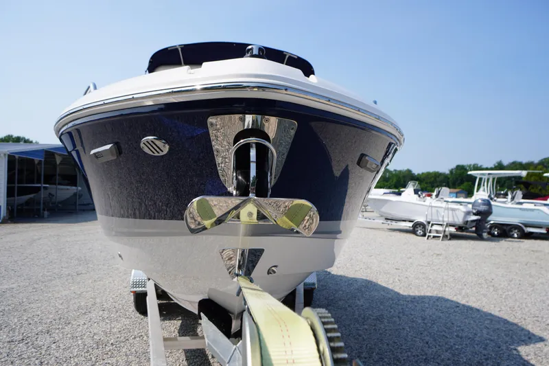 Slide: The Image of Rear view of 2025 Chaparral 267 SSX boat on trailer, showing propeller and trailer details. - 6