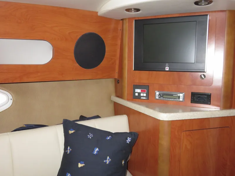 Slide: The Image of Interior of 2008 Rinker 280 Express Cruiser with TV and seating area. - 18