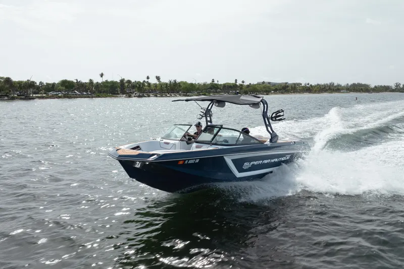 Slide: The Image of 2019 Nautique Super Air Nautique GS24 speeding on open water. - 1