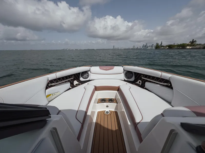Slide: The Image of 2019 Nautique Super Air Nautique GS24 boat interior with city skyline in background. - 28