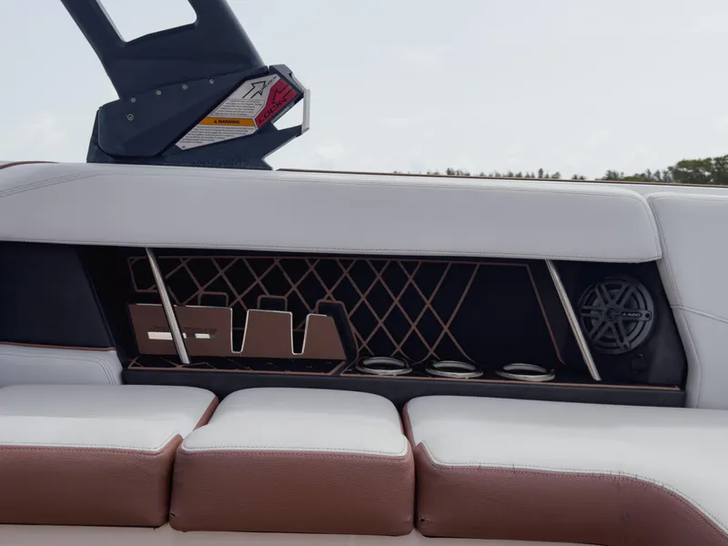 Slide: The Image of 2019 Nautique Super Air Nautique GS24 interior with cup holders and speaker. - 43