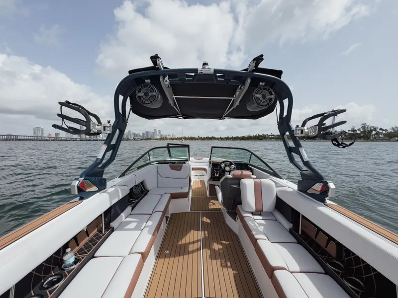 Slide: The Image of 2019 Nautique Super Air Nautique GS24 boat interior with spacious seating and advanced wakeboard tower. - 45