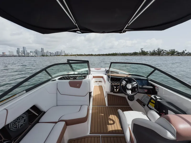Slide: The Image of 2019 Nautique Super Air Nautique GS24 boat interior with city skyline view. - 46
