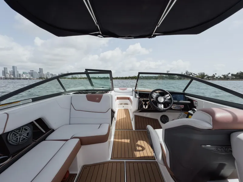 Slide: The Image of 2019 Nautique Super Air Nautique GS24 boat interior with city skyline view. - 47