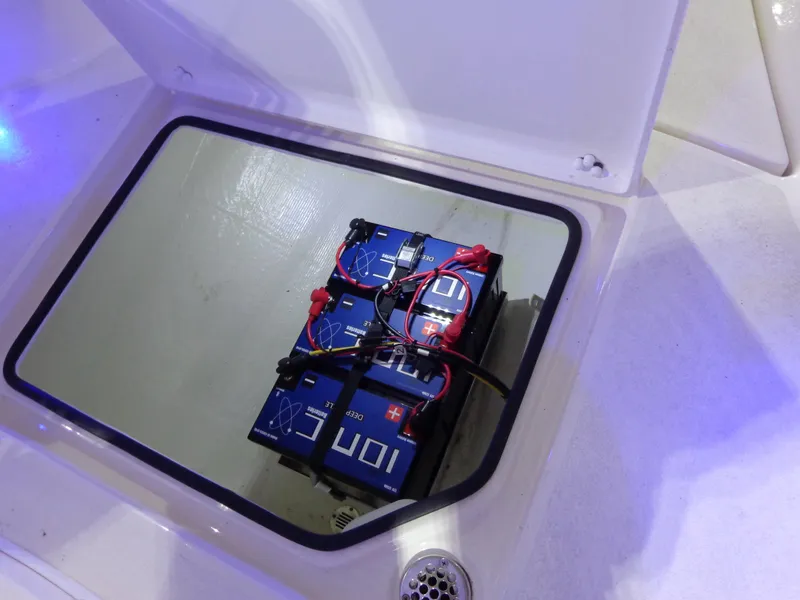 Slide: The Image of Battery compartment of 2023 Cobia 280 Center Console boat with wiring. - 41
