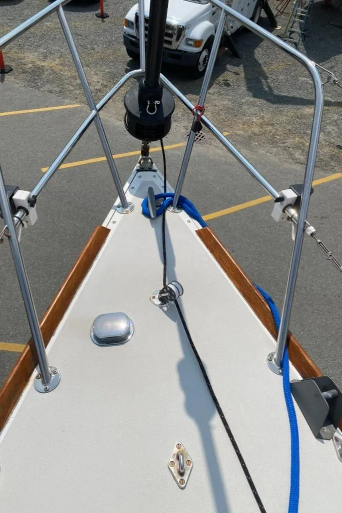 Slide: The Image of Bow of 1986 Express 37 sailboat with rigging and deck details. - 11