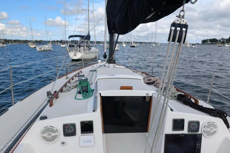 Slide: The Image of Sailboat deck view on water, Express 37 model, 1986, with ropes and instruments. - 17