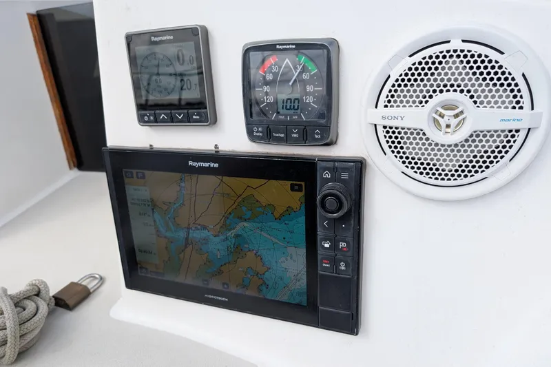 Slide: The Image of Boat navigation equipment with Raymarine displays and Sony marine speaker on Express 37, 1986 model. - 23