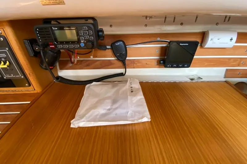 Slide: The Image of Boat interior with communication equipment and wooden surface, Express 37, 1986 model. - 30