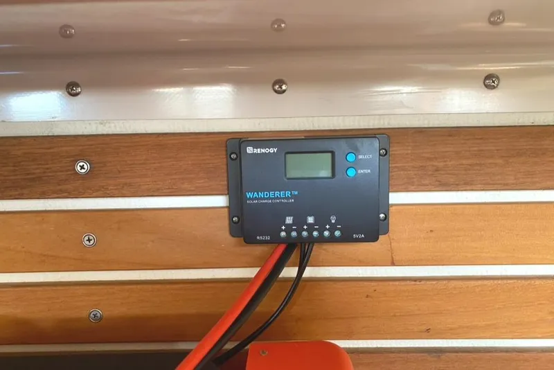 Slide: The Image of Solar charge controller on wooden panel, Express 37, 1986 model. - 43