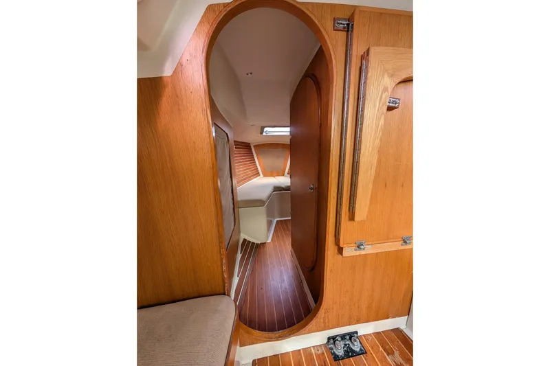 Slide: The Image of Interior of 1986 Express 37 sailboat with wooden paneling and cozy cabin space. - 46