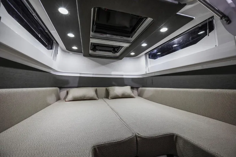Slide: The Image of Luxurious interior cabin of 2025 Axopar 37 Sun Top with modern lighting and comfortable seating. - 12