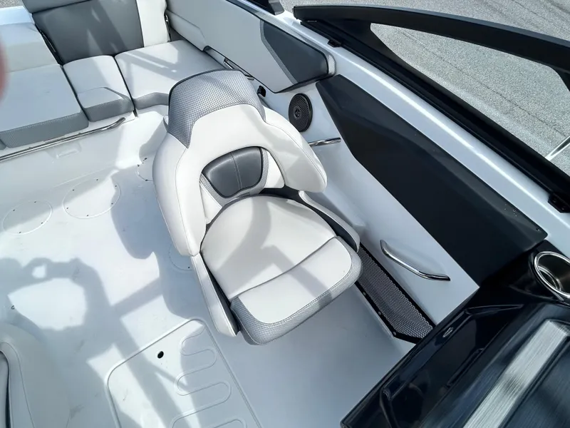 Slide: The Image of Interior of 2025 Scarab 195 SE boat with modern seating and sleek design. - 12