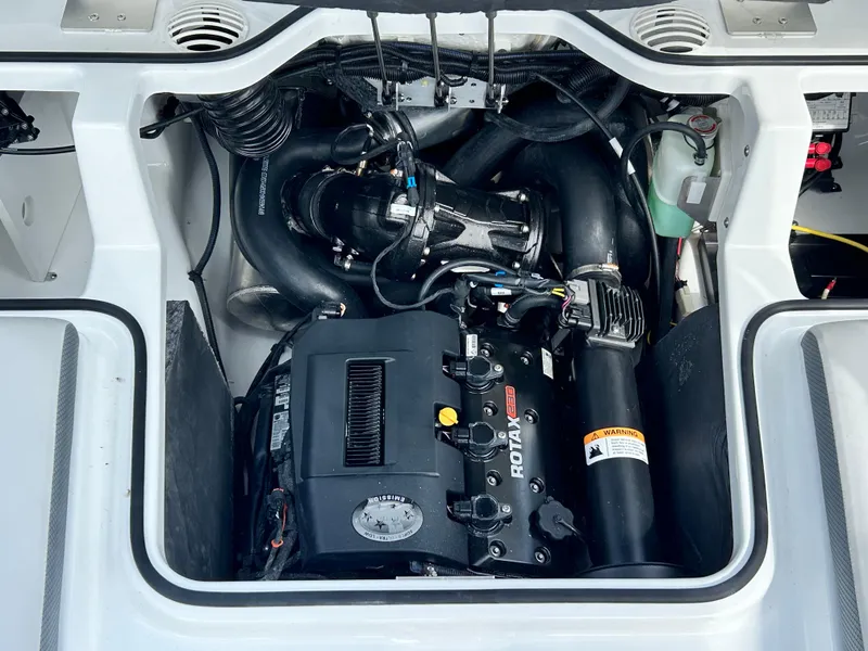 Slide: The Image of Engine compartment of 2025 Scarab 195 SE boat, featuring a Rotax engine. - 18