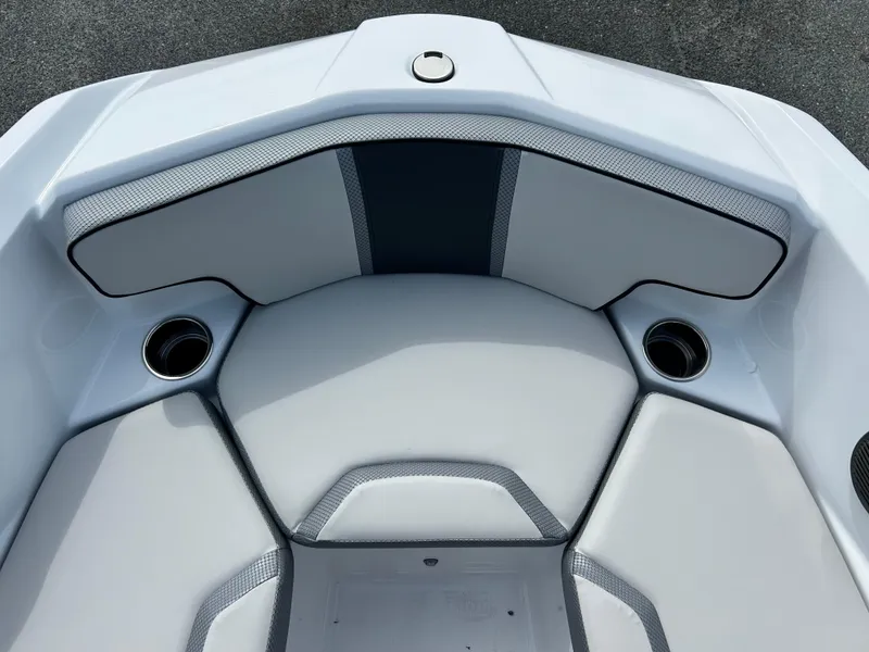 Slide: The Image of 2025 Scarab 195 SE boat interior with cushioned seating and cup holders. - 8