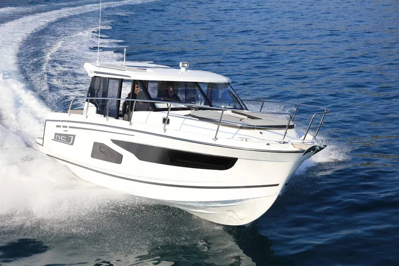 The Image of 2023 Jeanneau NC1095 cruising on open water, showcasing sleek design and performance. - 0