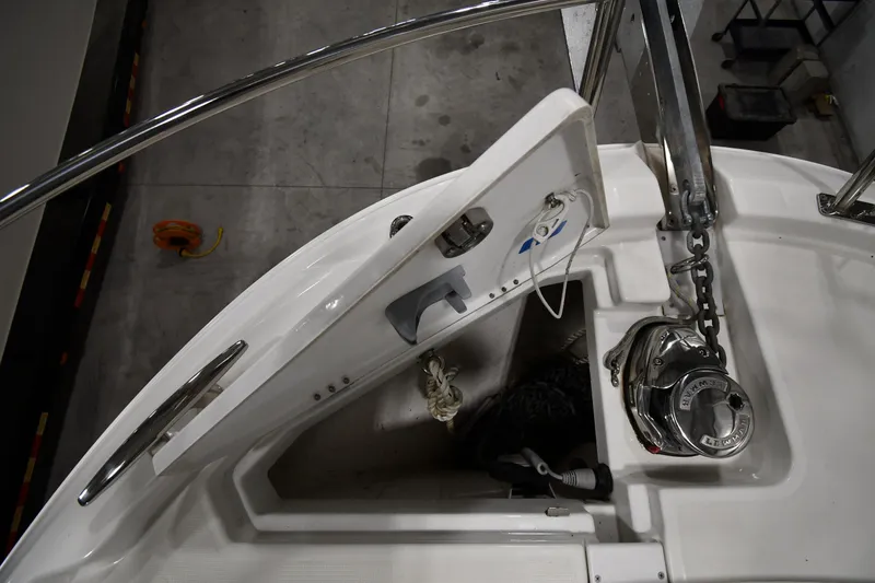 Slide: The Image of 2023 Jeanneau NC1095 boat anchor system with chain and winch in a marina. - 13