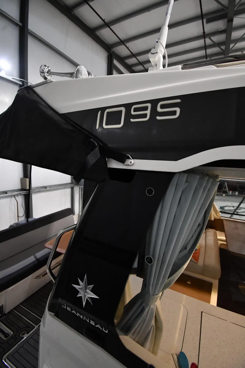 Slide: The Image of 2023 Jeanneau NC1095 boat interior with branding and sleek design. - 18