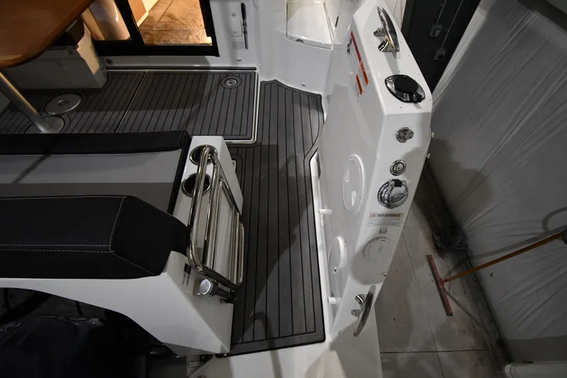 Slide: The Image of Interior view of 2023 Jeanneau NC1095 boat, featuring sleek seating and modern design elements. - 25