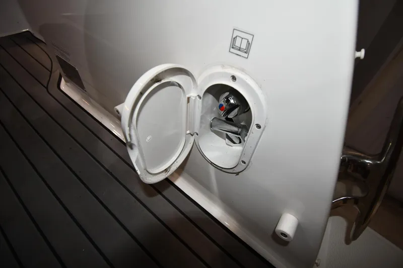 Slide: The Image of 2023 Jeanneau NC1095 boat water inlet on deck with open cover. - 26