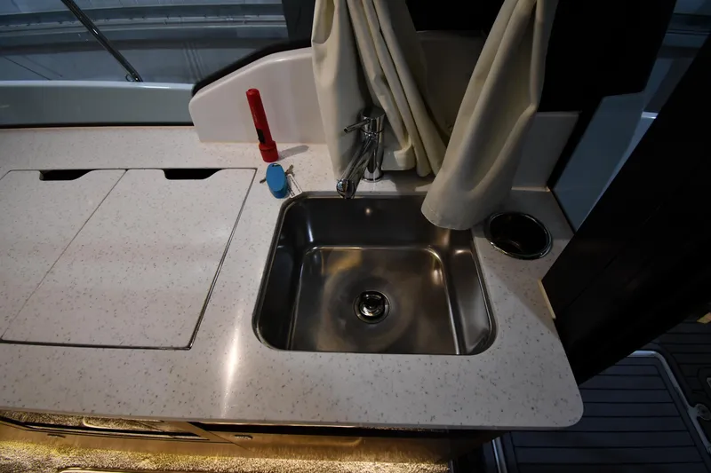 Slide: The Image of 2023 Jeanneau NC1095 boat kitchen sink with countertop and faucet. - 45