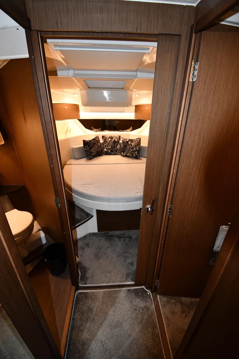 Slide: The Image of 2023 Jeanneau NC1095 cabin interior with cozy bed and modern design. - 49