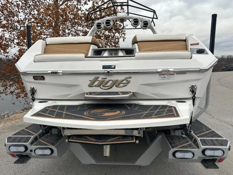 Slide: The Image of 2025 Tigé Ultré 25ZX boat rear view with sleek design and modern features. - 1