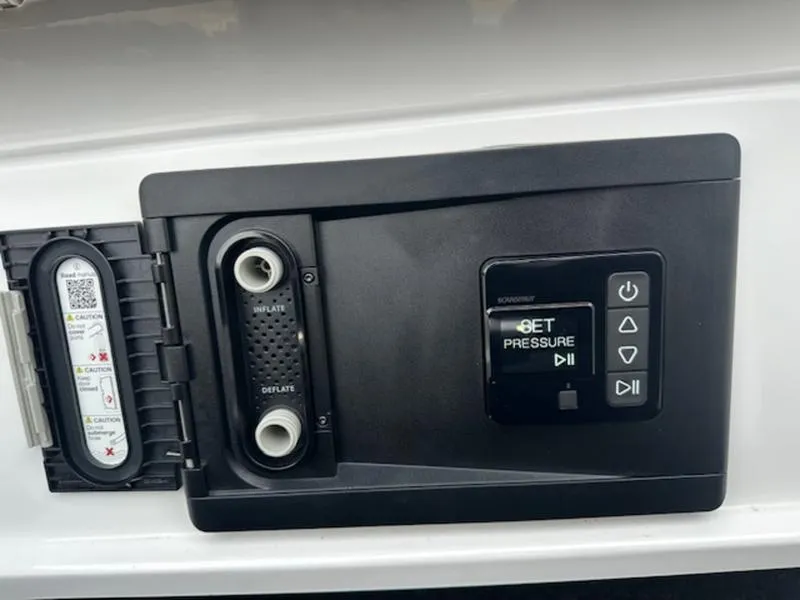 Slide: The Image of Control panel of 2025 Tigé Ultré 25ZX boat, featuring pressure settings and inflator/deflator options. - 15