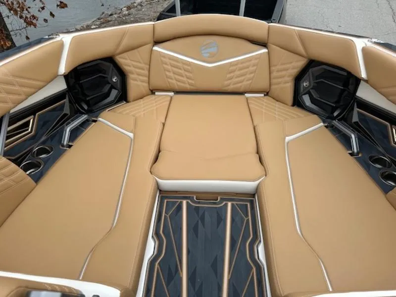 Slide: The Image of 2025 Tigé Ultré 25ZX boat interior with tan leather seating and modern design. - 6