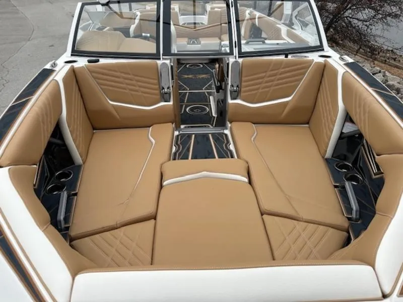 Slide: The Image of 2025 Tigé Ultré 25ZX boat interior with tan leather seating and modern design. - 7