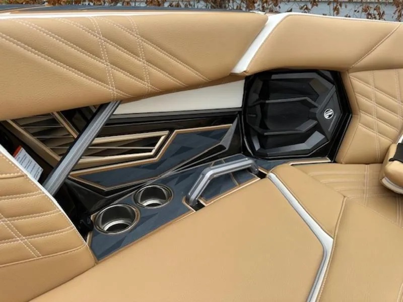 Slide: The Image of 2025 Tigé Ultré 25ZX interior with tan leather seats and modern design elements. - 8